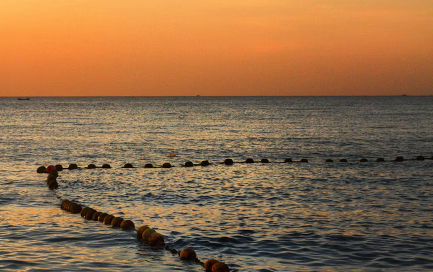 Pattaya Beach sunset Thailand golden sky over the sea with city skyline silhouette